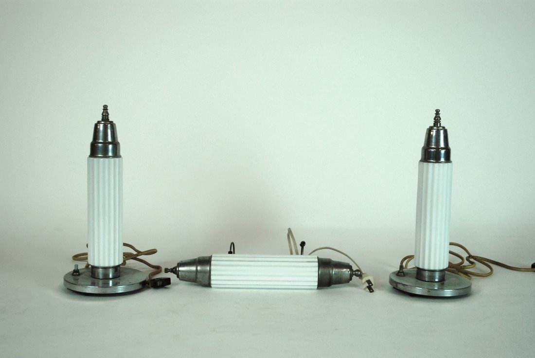 Art Deco Vanity Set: Pair of chrome plated and frosted vanity lamps and center adjustable light. 11.5H