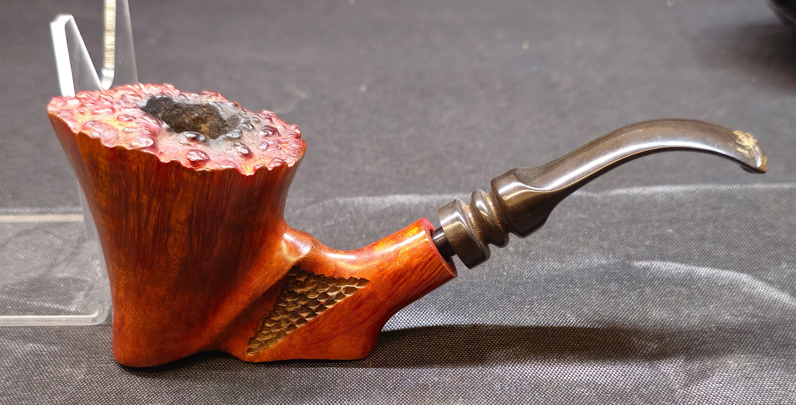 Handcrafted Polished Burl Wood Pipe: Handcrafted burl wood tobacco pipe of unusual sculptural form, featuring richly figured natural burl grain with a polished finish. The distinctive organic shape highlights the natural character and