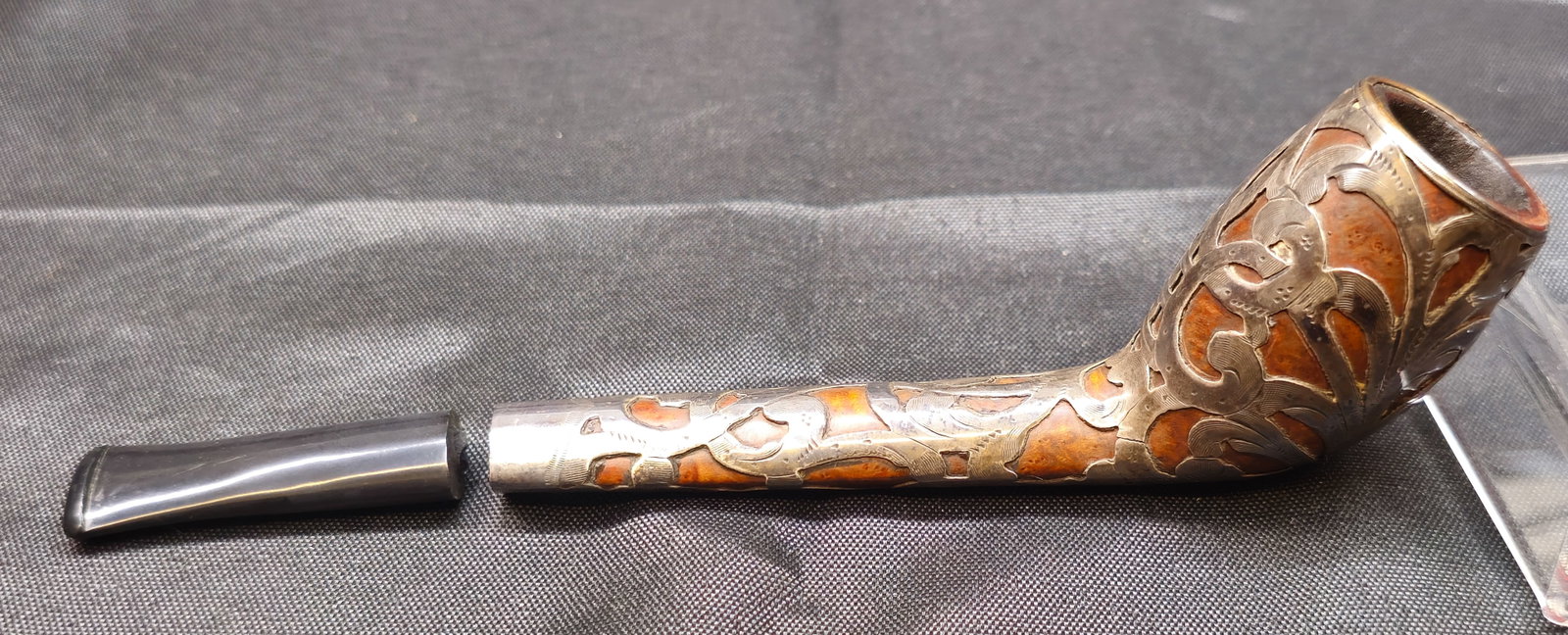 Unmarked Silver-Tone Overlay Pipe: Unmarked Silver-Tone Overlay Tobacco Pipe. Unusual tobacco pipe featuring an ornate silver-tone floral and foliate overlay with warm reddish-brown inlaid or exposed sections throughout the bowl and