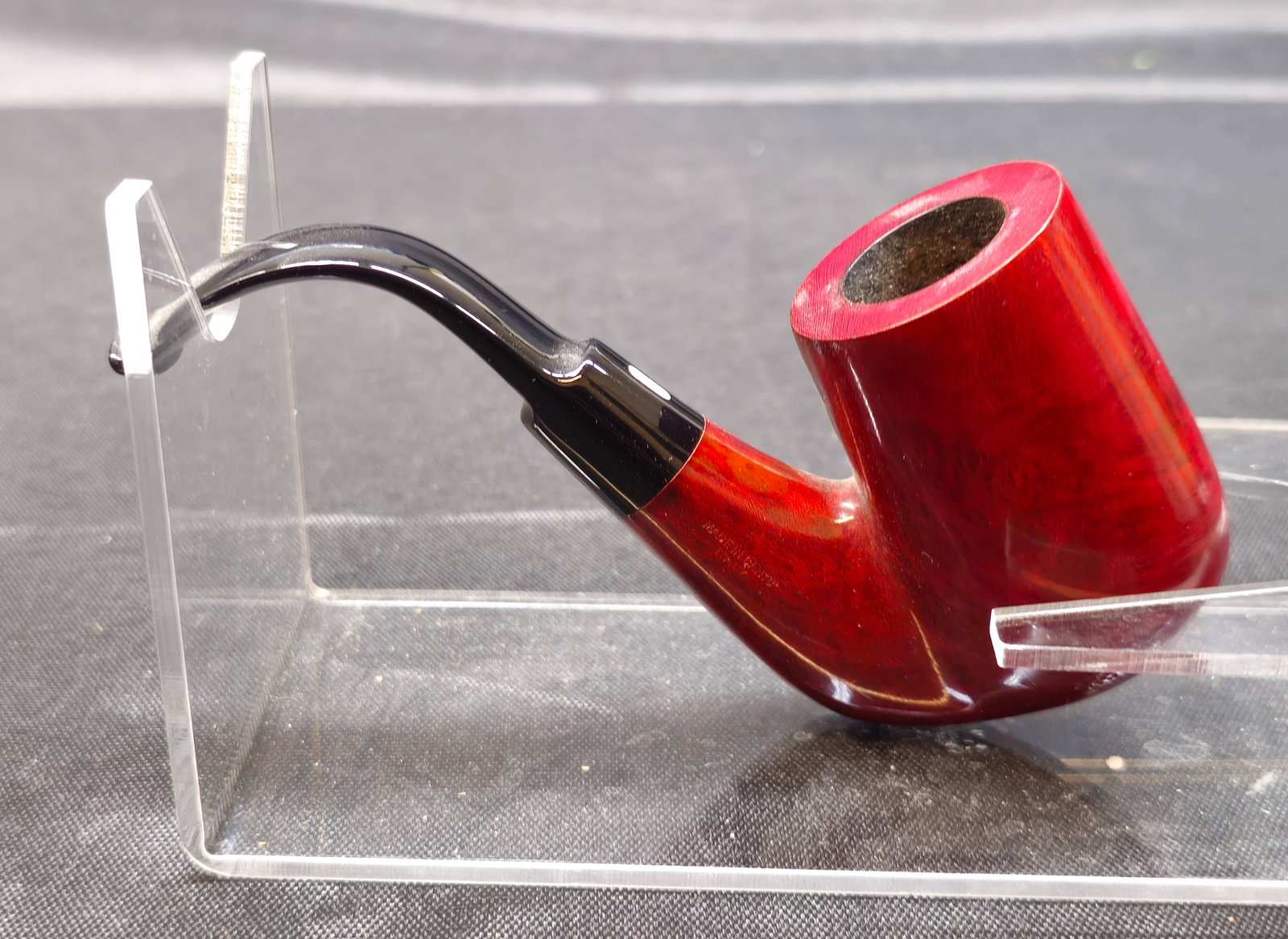 Castello Trade Mark Bent Dublin: Castello Trade Mark Bent Dublin. Italian briar tobacco pipe with a deep red polished finish, bent Dublin form and black stem. Marked "Castello Trade Mark" and "Made in Cantu Italy," with additional "7