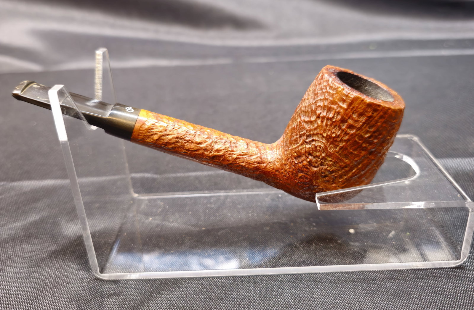 Charatan's Make 442DC: Charatan's Make 442DC. English briar tobacco pipe with rusticated finish, straight form and black stem with CP logo. Marked "Charatan's Make London England," "442DC," and Reg. No. 203573 to stem.