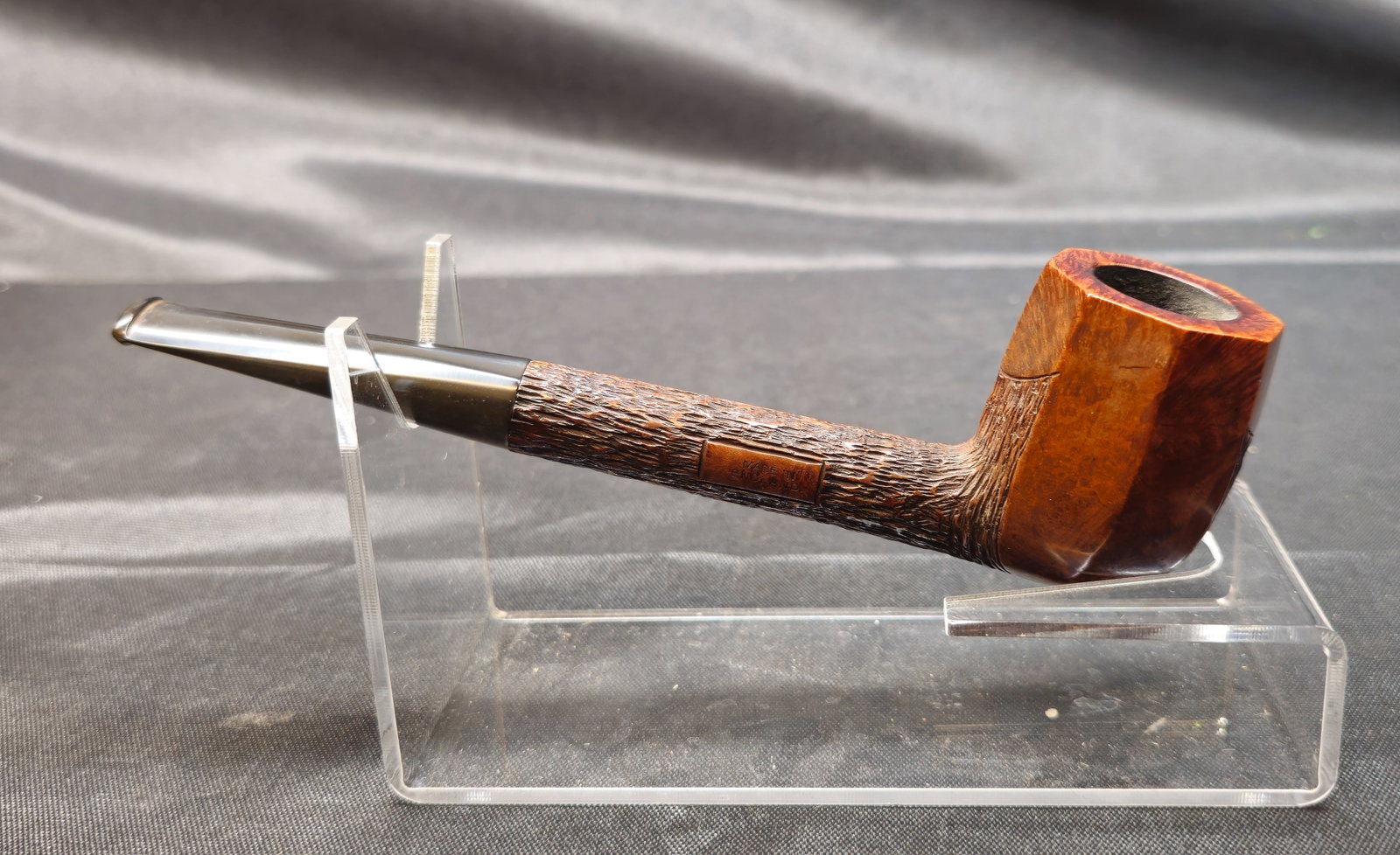 Barling's Make Ye Olde Wood T.V.F.: Barling's Make Ye Olde Wood T.V.F. English briar tobacco pipe in a paneled billiard shape with a partially rusticated long shank, smooth paneled bowl and tapered black stem. Marked "Barling's Make Ye