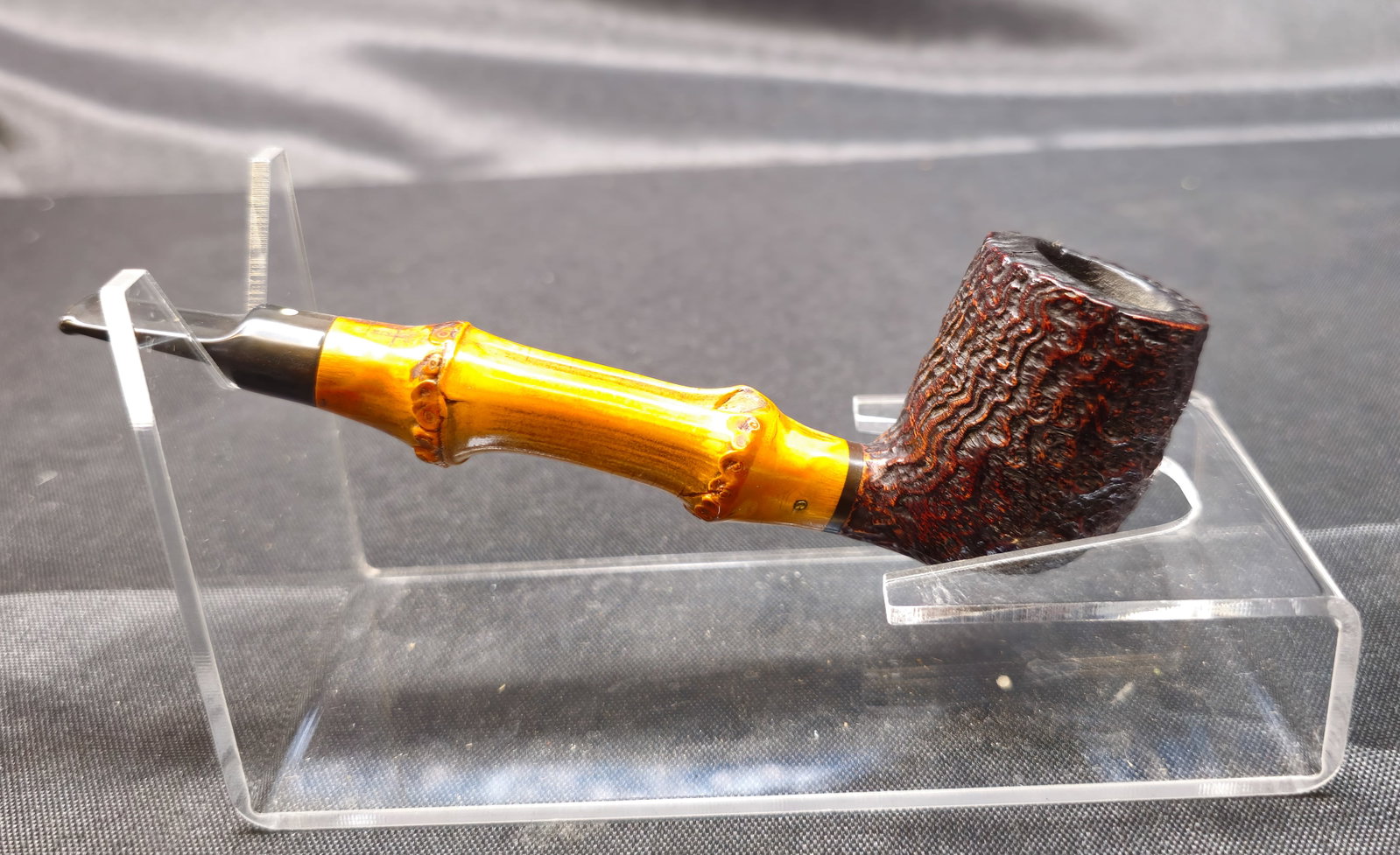 Italian Bamboo Shank W 60 S: Italian Bamboo Shank W 60 S. Briar tobacco pipe with dark rusticated bowl, natural bamboo shank, black mouthpiece, and metal accent band. Stamped "W 60 S" with "Made in Italy" to underside.