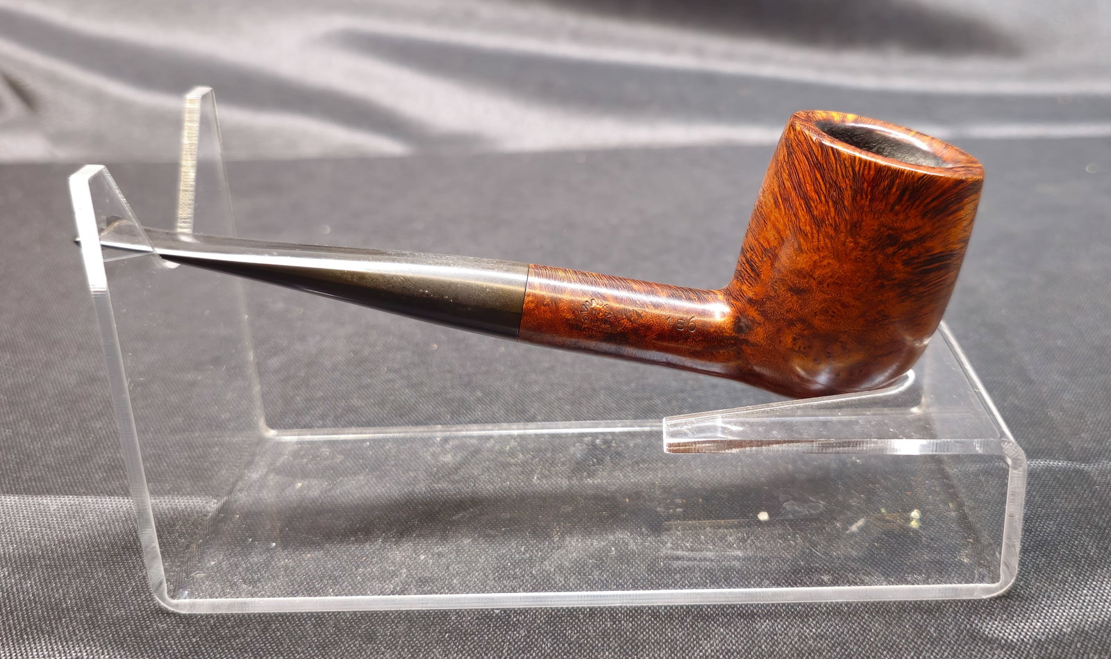 Comoy's Tradition 196: Comoy's Tradition 196. English briar tobacco pipe with smooth finish, straight form and black mouthpiece bearing the Comoy's "C" logo. Stamped "Comoy's Tradition," "Made in London England" and shape