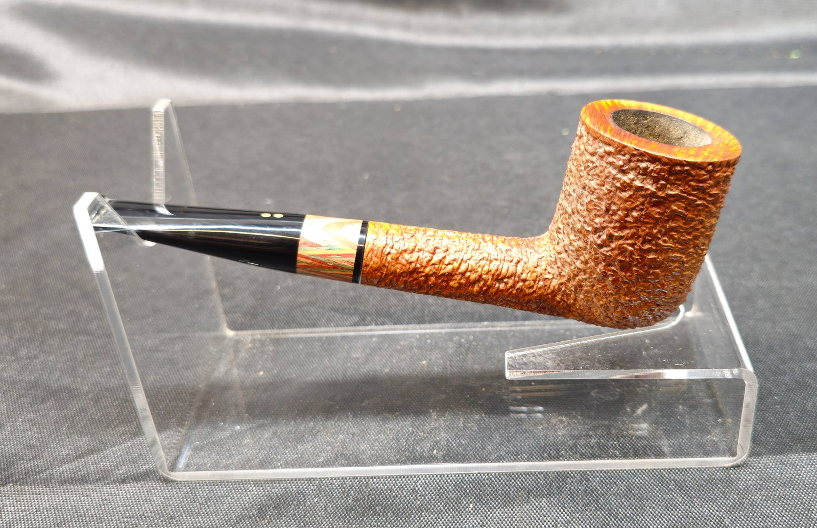 Radice Rind: Radice Rind Hand Made in Italy. Italian briar tobacco pipe with rusticated finish, straight form, black mouthpiece with double-dot logo, and distinctive multicolor laminated accent at the shank.