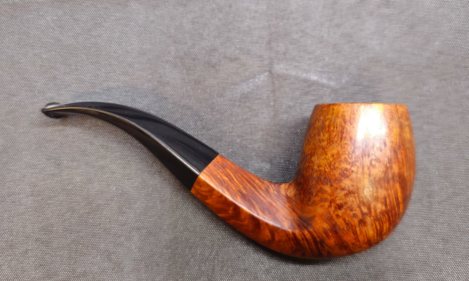 Castello Collection Carlo Scotti Pipe: Castello Collection Carlo Scotti Pipe. Italian briar tobacco pipe with smooth warm brown finish, prominent grain, bent form, and black mouthpiece with white stem dot. Marked "CASTELLO COLLECTION