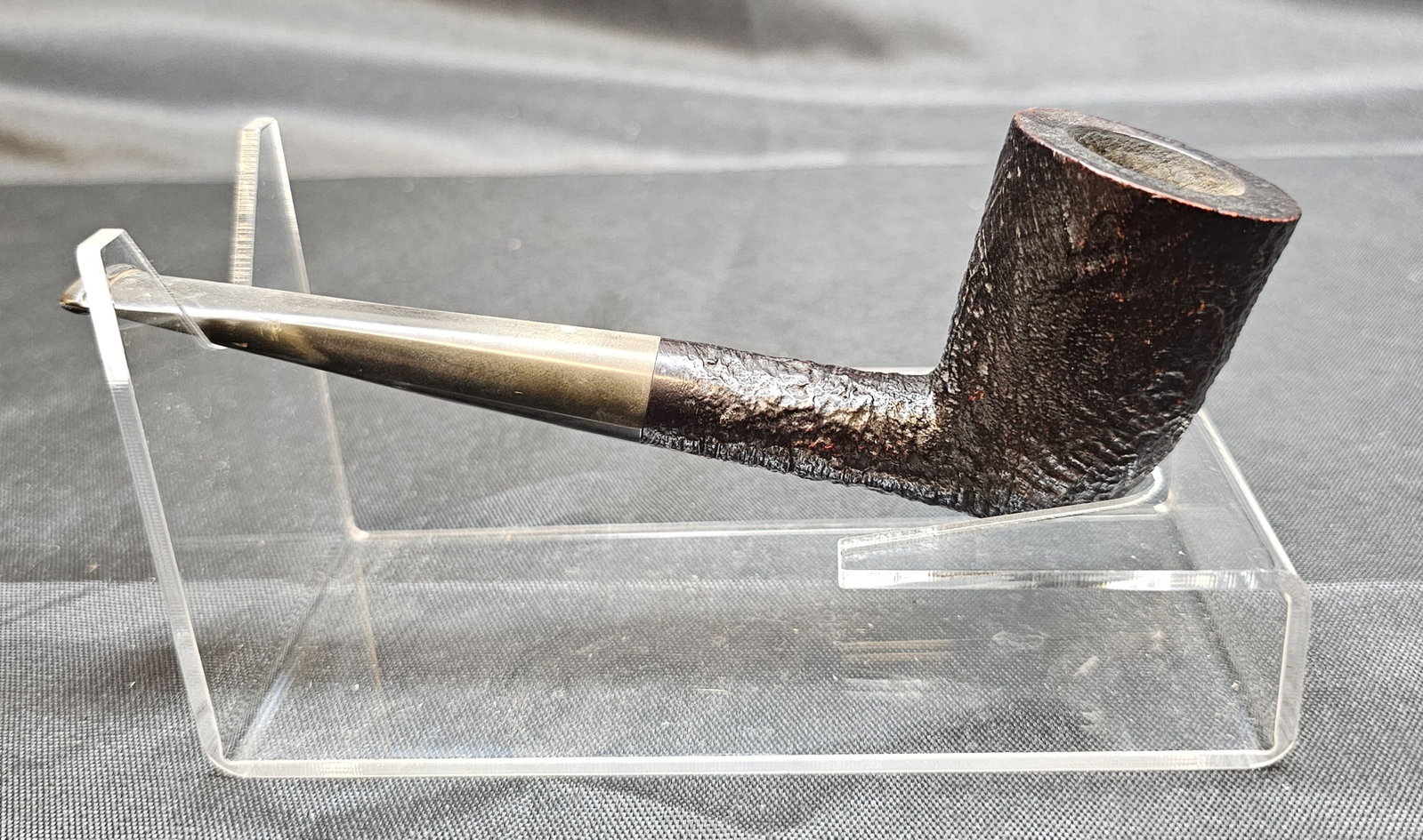 Dunhill Shell 61051 Pipe: Dunhill Shell 61051 Pipe. English briar tobacco pipe with dark sandblasted Shell finish, straight form and black mouthpiece with white dot. Stamped "61051 DUNHILL SHELL MADE IN ENGLAND."