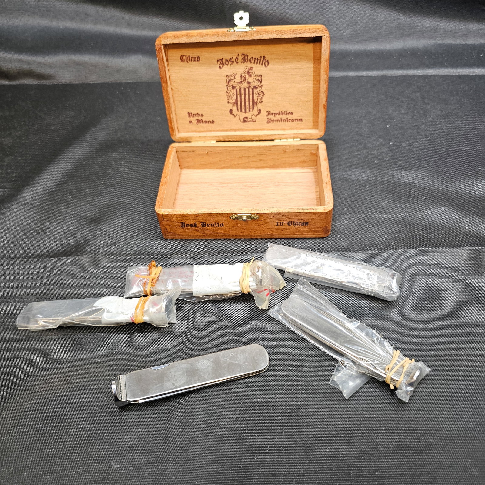 Dunhill Folding Pipe Tool with José Benito Cigar Box: Dunhill Folding Pipe Tools with José Benito Cigar Box. (5) total; Stainless steel folding pipe tool featuring a serrated reamer/cleaning blade marked "dunhill," together with assorted additional 