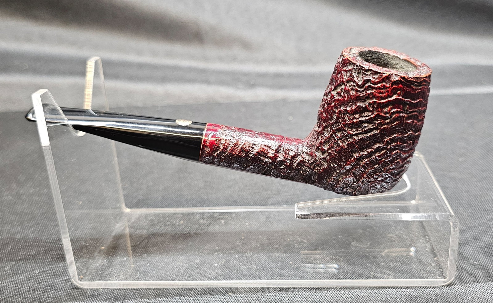 Mastro de Paja 1B Pipe: Mastro de Paja 1B Pipe. Italian briar tobacco pipe in a straight billiard shape with a deep rusticated finish in dark burgundy and black stem with silver-tone sunburst logo. Smooth shank panel marked