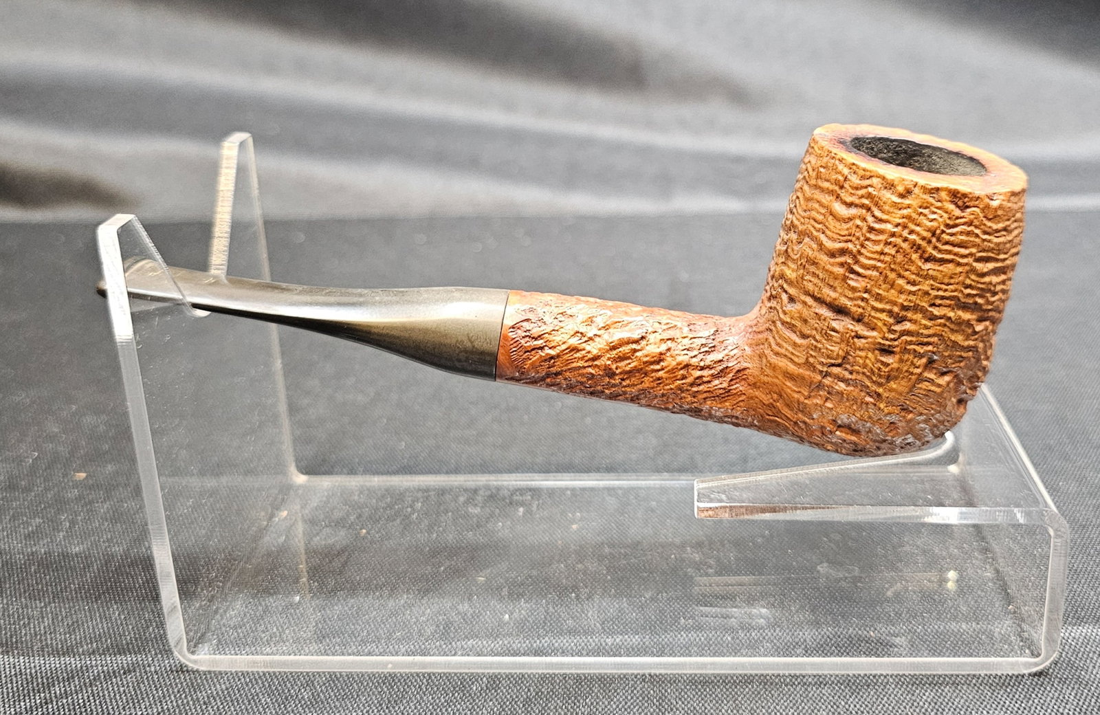 Charatan's Make 4420 Pipe: Charatan's Make 4420 Pipe. English briar tobacco pipe with natural sandblasted finish, straight form and black mouthpiece bearing the Charatan CP logo. Stamped "CHARATAN'S MAKE LONDON ENGLAND,"