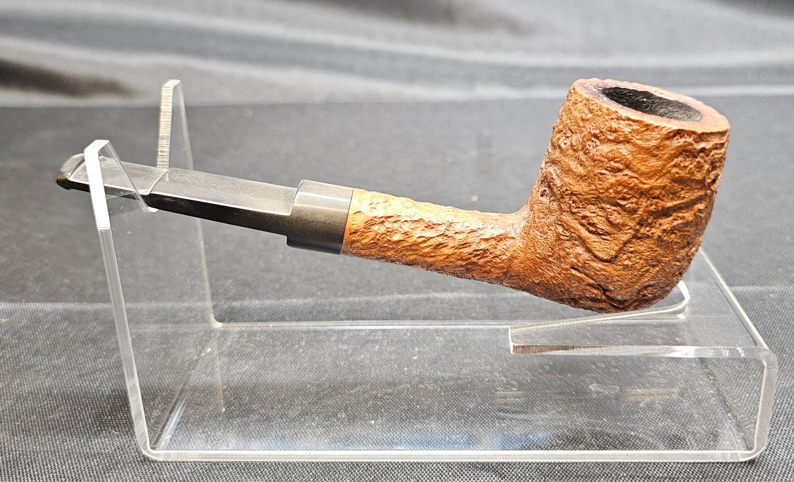 Charatan's Make 4420 Pipe: Charatan's Make 4420 Pipe. English briar tobacco pipe with natural sandblast finish, straight form and black mouthpiece bearing the Charatan CP logo. Stamped "CHARATAN'S MAKE LONDON ENGLAND," "4420,"