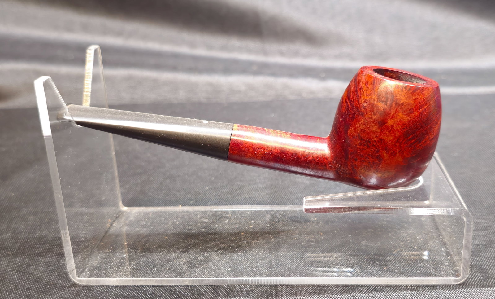 Dunhill Bruyere K Pipe: Dunhill Bruyere K Pipe. English briar tobacco pipe with rich red Bruyere finish, straight form and black mouthpiece. Stamped "K," "DUNHILL BRUYERE," and "MADE IN ENGLAND" with additional markings.