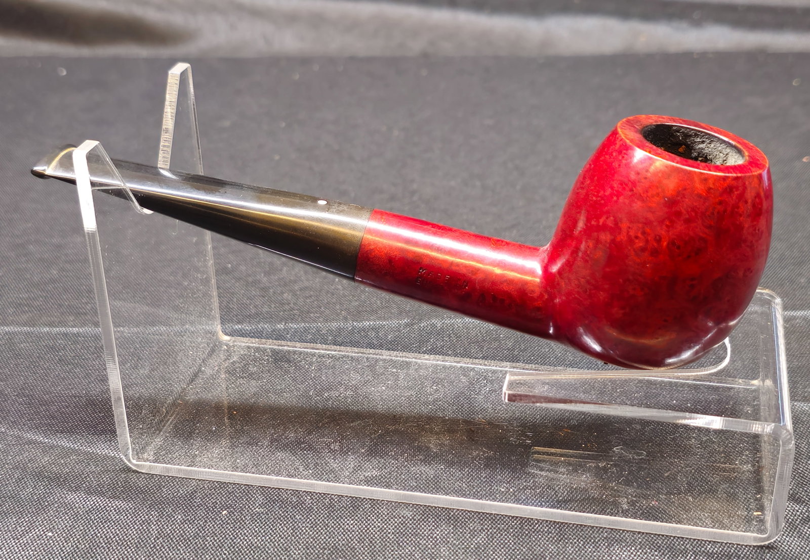Dunhill Bruyere ODA 806 F/T Pipe: Dunhill Bruyere ODA 806 F/T Pipe. English briar tobacco pipe with rich red smooth finish, substantial rounded bowl and black fishtail mouthpiece with Dunhill white spot. Stamped "ODA 806 F/T,"