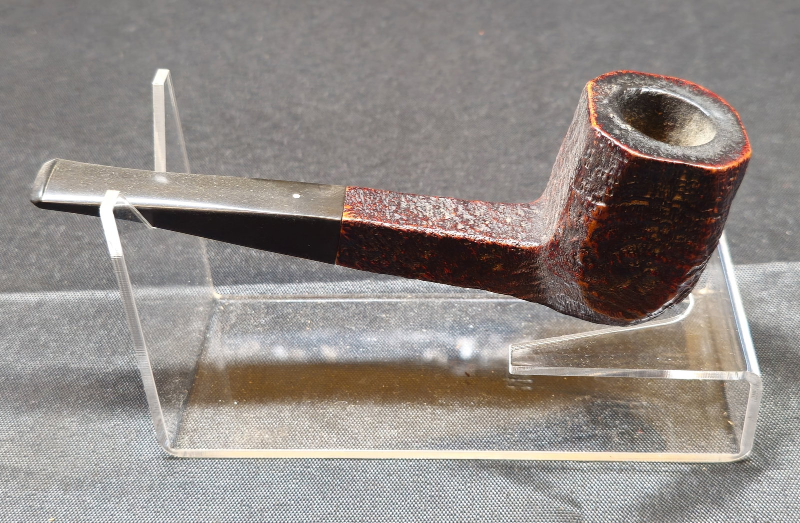 Dunhill Shell Briar 169 Pipe: Dunhill Shell Briar 169 Pipe. English briar tobacco pipe with dark sandblasted finish, bent Dublin shape and black curved mouthpiece with Dunhill white spot. Stamped "DUNHILL," "169 SHELL BRIAR," and