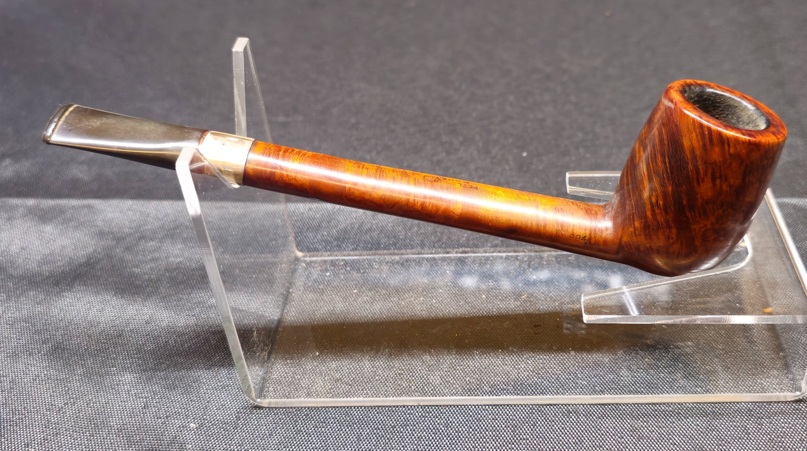 Peterson's Kapp-Royal 994 Pipe: Peterson's Kapp-Royal 994. Irish briar tobacco pipe with warm brown smooth finish, long straight shank, silver-tone band and black mouthpiece. Stamped “PETERSON'S KAPP-ROYAL” with shape