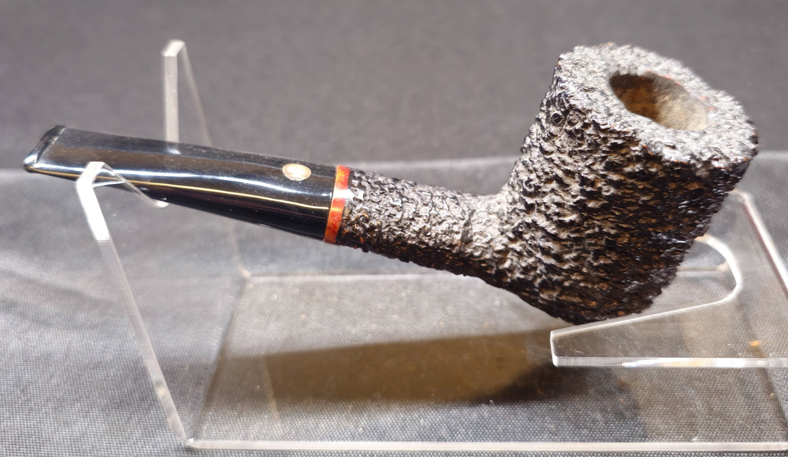 Mastro de Paja Brugo Pesaro Media 03 Pipe: Mastro de Paja Brugo Pesaro Media 03. Italian briar tobacco pipe with deeply rusticated black finish, red accent at shank and black mouthpiece with Mastro de Paja sun emblem. Stamped