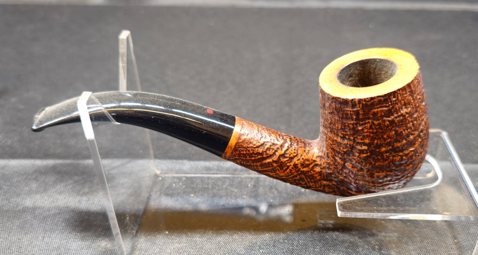 Ser Jacopo Per Aspera Ad Astra Bent Pipe: Ser Jacopo Per Aspera Ad Astra Bent Pipe. Italian briar tobacco pipe with rusticated warm brown finish, bent stem and black mouthpiece with red dot accent. Stamped “PER ASPERA AD ASTRA,”
