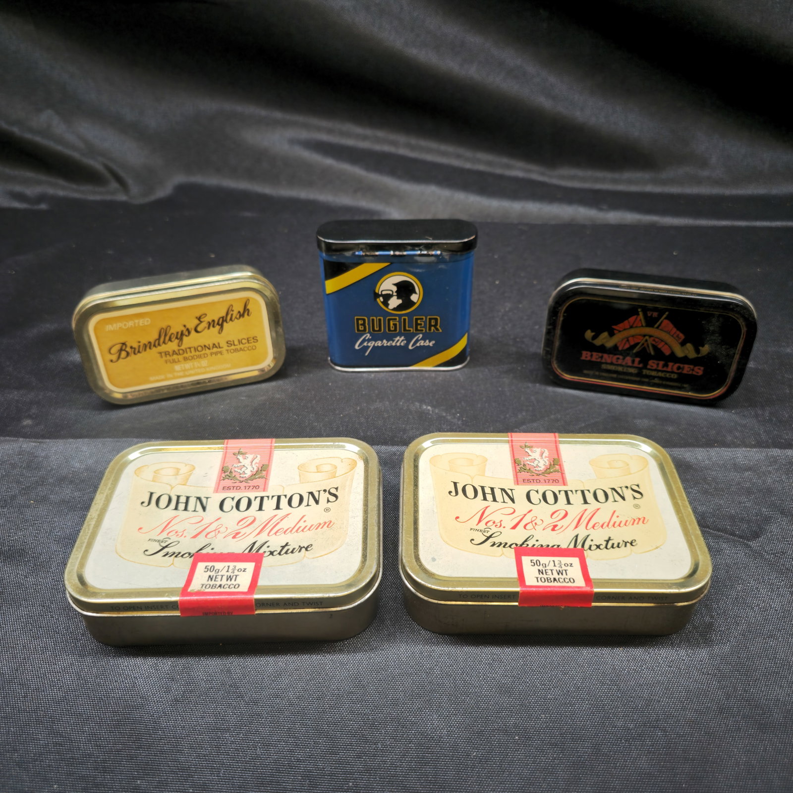 Collection of Five Vintage Tobacco & Cigarette Tins: Collection of five vintage tobacco and cigarette tins comprising two John Cotton's Nos. 1 & 2 Medium Smoking Mixture 50g tins with tax seals, Brindley's English Traditional Slices pipe tobacco tin, Be