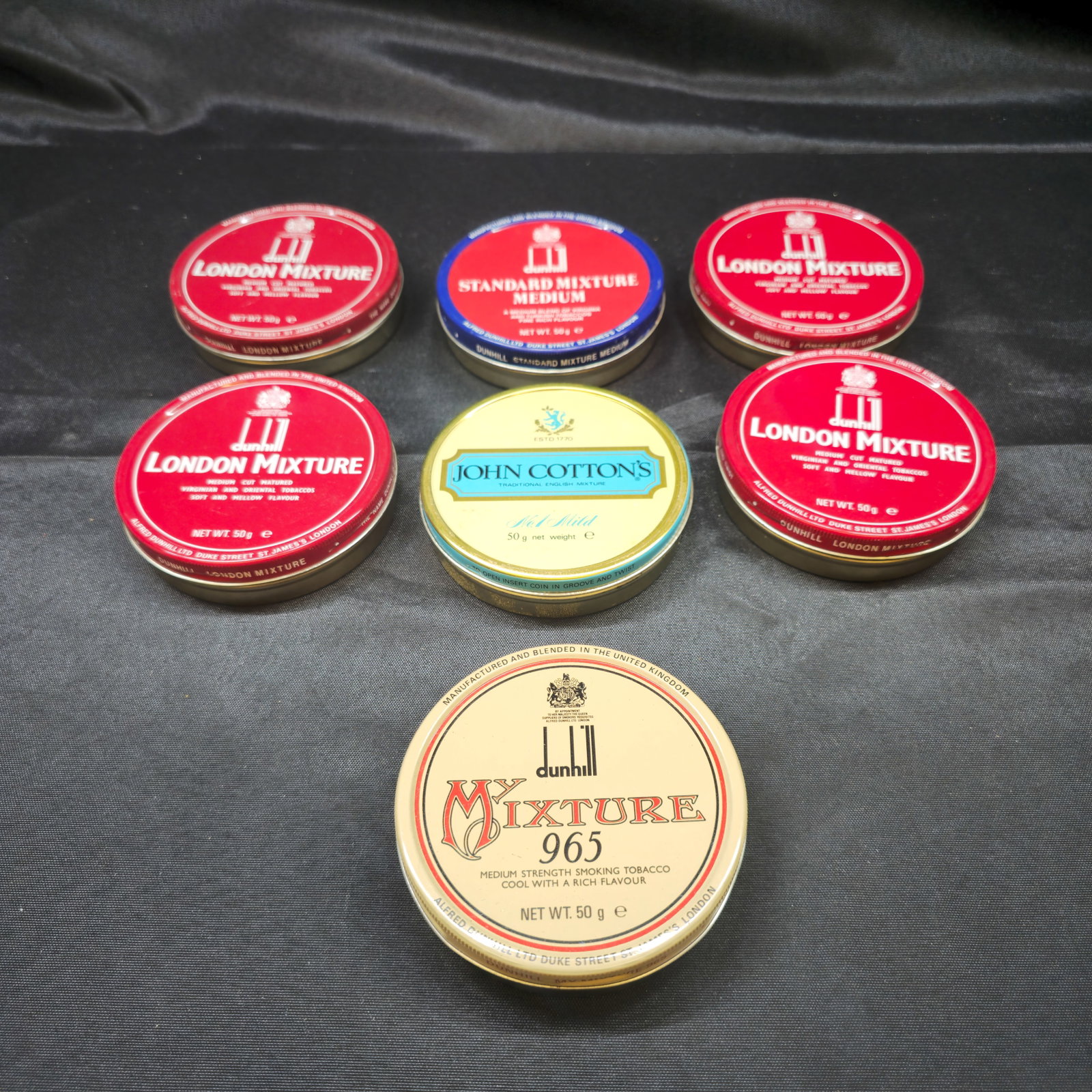 Collection of Seven Dunhill & John Cotton's Tobacco Tins: Collection of seven vintage tobacco tins comprising four Dunhill London Mixture 50g tins, one Dunhill Standard Mixture Medium 50g tin, one Dunhill My Mixture 965 50g tin, and one John Cotton's No. 1