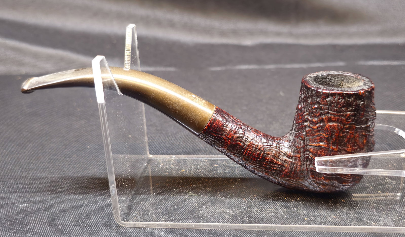 Dunhill Shell Briar 120 Pipe: Dunhill Shell Briar 120 Pipe, English briar tobacco pipe in a bent billiard shape with deep craggy sandblast finish in reddish-brown and black tones, fitted with a bent vulcanite stem bearing the Dunh