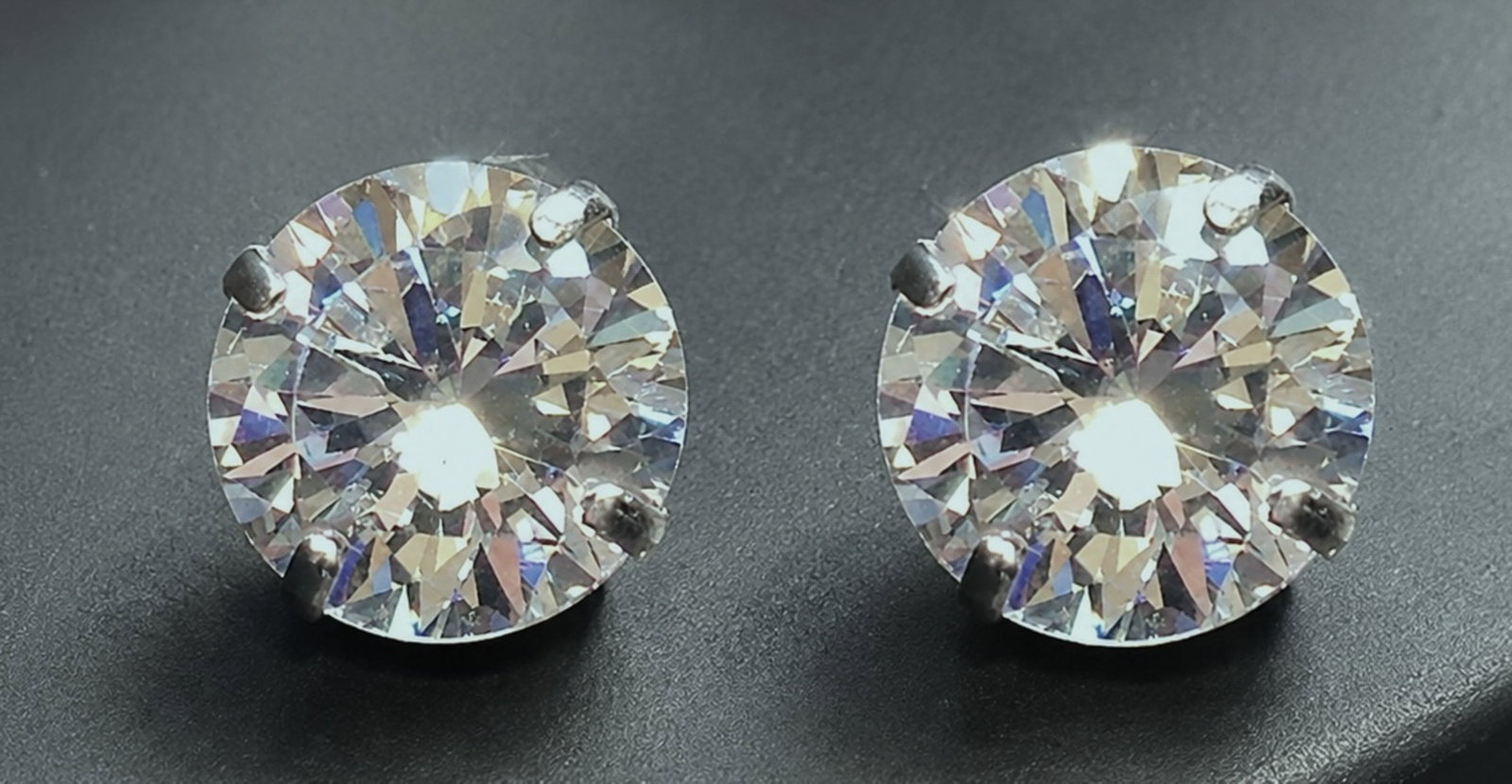 14K White Gold 3.00 CTW Natural Diamond Stud Earrings: Pair of 14K white gold stud earrings set with round brilliant-cut natural diamonds weighing approximately 3.00 carats total weight. Diamonds with supplied grading information of Cutting Grade 5,