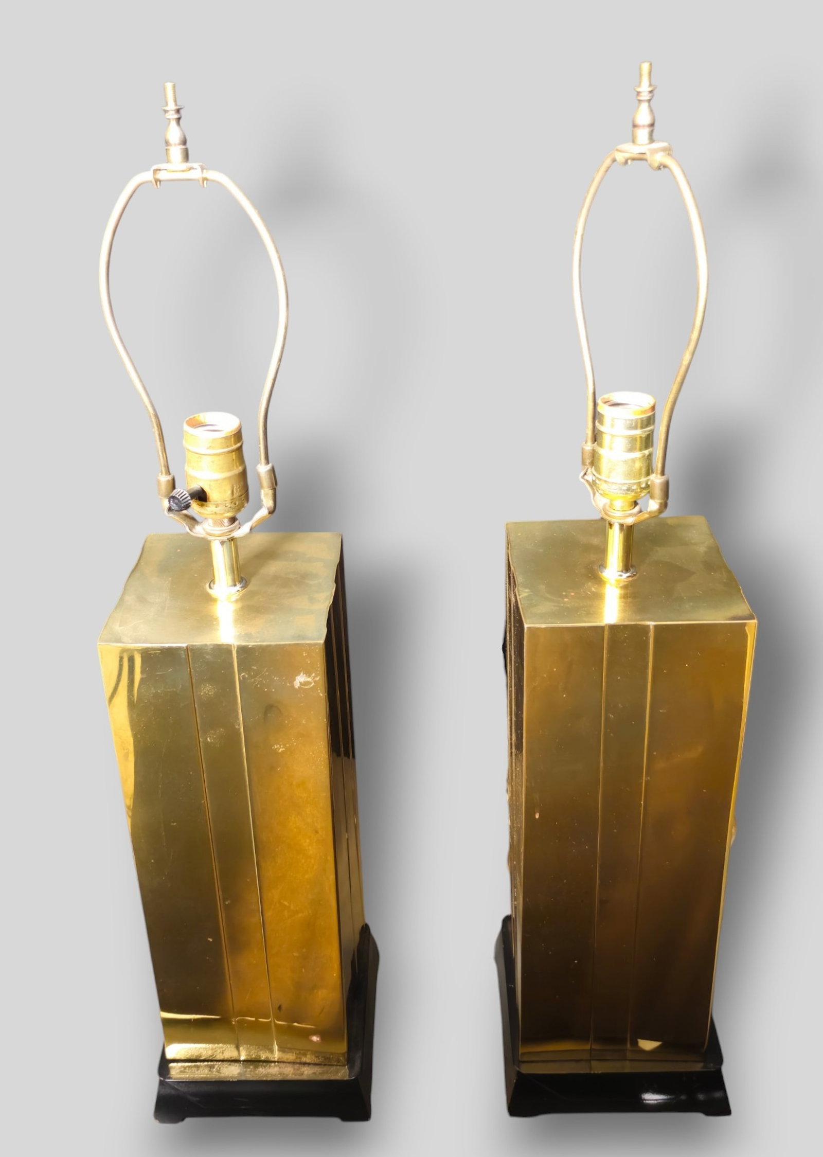 MCM Brass Skyscraper Table Lamps: MCM Brass Skyscraper Table Lamps. Pair. USA. 1970. Brass and lacquered wood. 6w x 6d x 27h.