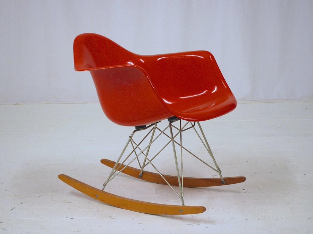 Charles and Ray Eames: Rare salmon colored arm shell on RAR base. Herman Miller. Original birch runners. 25W x 25D x 27H