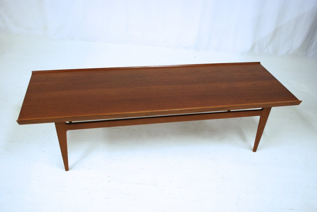 Finn Juhl: Teak rectangular coffee table. Tapered edges and legs. France and Sons. 69L x 23.5W x 17.75H
