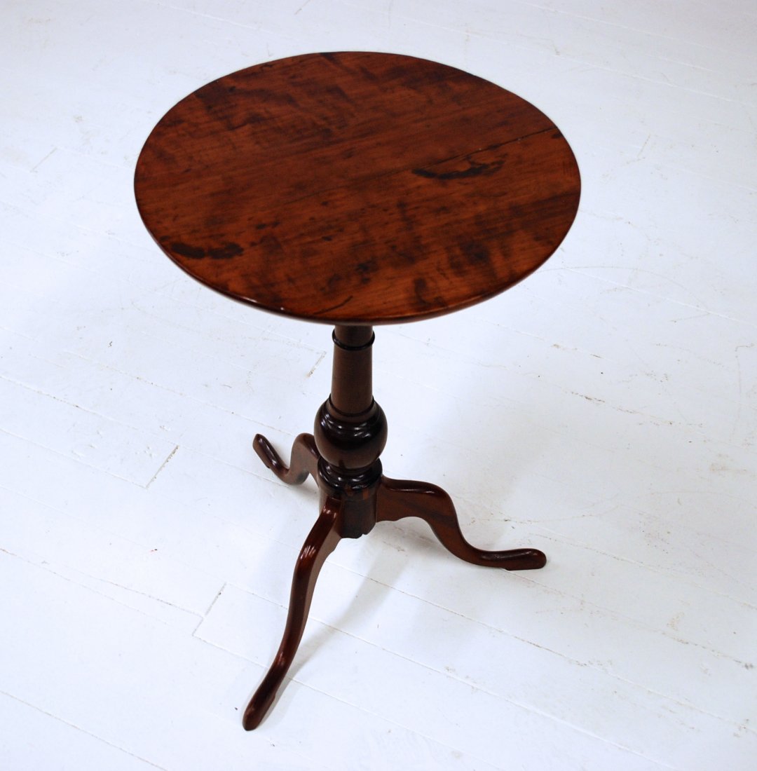 Queen Anne Candle Stand: New England or Penn., circa 1790, with three cabriole legs with slipper feet, vase form turned column and fixed one board round top, 25.5 x 16.5 x 17”. From the Collection of Charles Yeiser