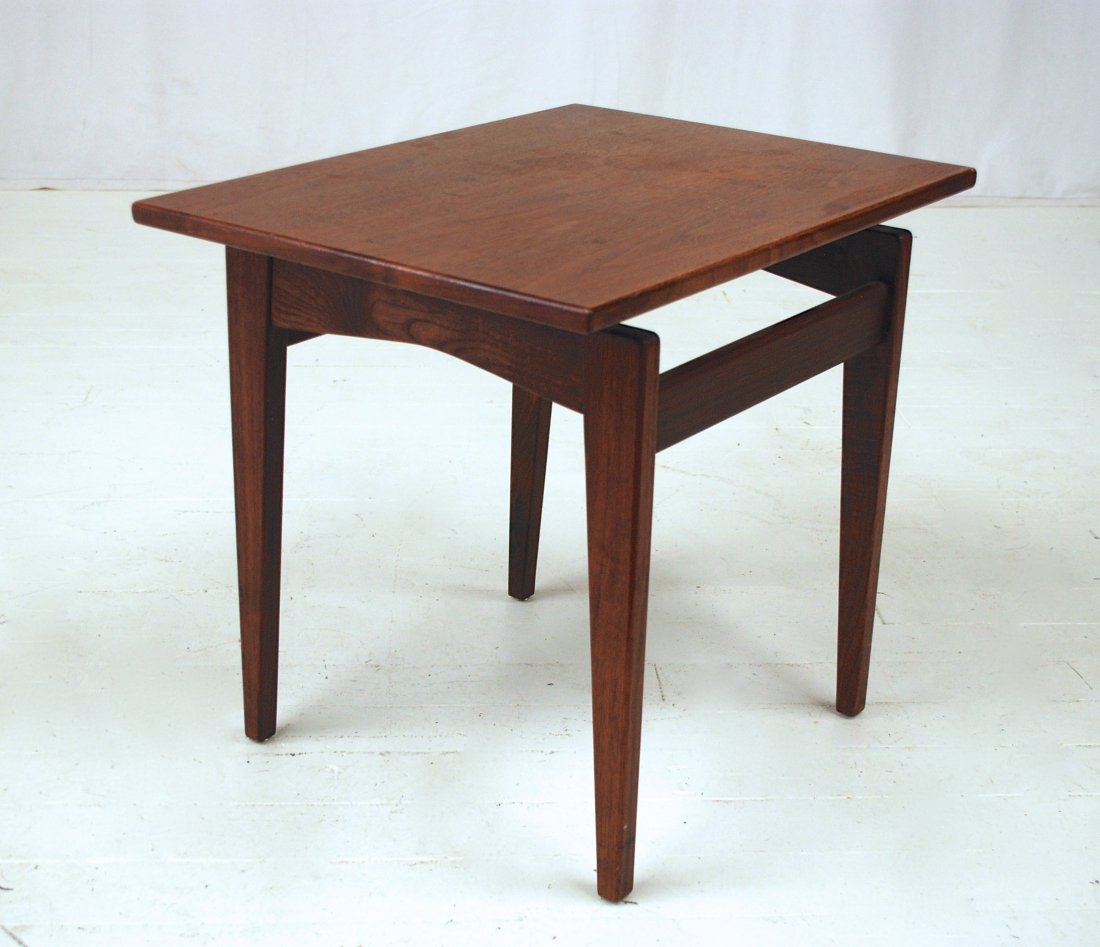 Jens Risom: Slender Walnut occasional table. Jens Pisom Inc. Original label to underside. 24 x 16 x 21