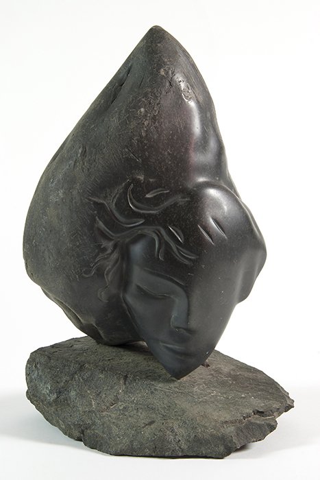 J. Thorpe: Stone sculpture of mystical abstract of woman's head on stone base. Signed on reverse iron support. 11W x 6D x 16.25H