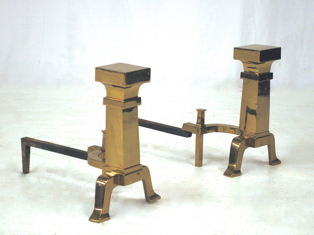 In the Manner of Samuel Marx: Simple, elegant andirons. Unmarked. Brass and metal. 17H