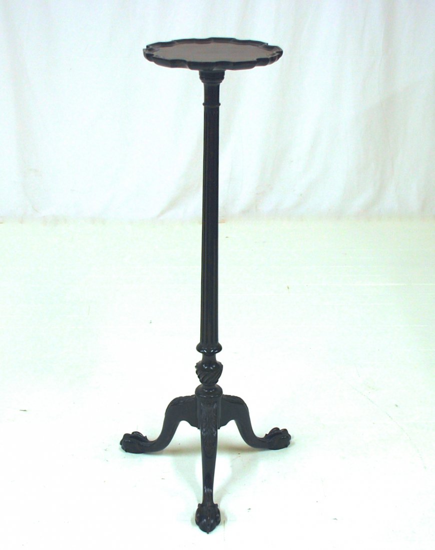 Centennial Chippendale Plant Stand: Mahogany with scalloped dished top, tapered fluted column, with urn turning at base, claw and ball cabriole legs with acanthus carved knees, 12” diameter x 43” high. From the Estate of William App