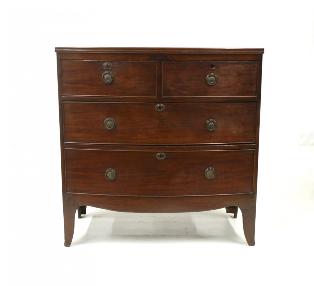 Period Hepplewhite Bow Front Chest: Mahogany, circa 1820, with two over two graduated dovetailed drawers, with cock beaded edges, solid end and scrolled apron and French feet, oak secondary wood, replaced brass pulls, 34.5 x 19 x 35” 