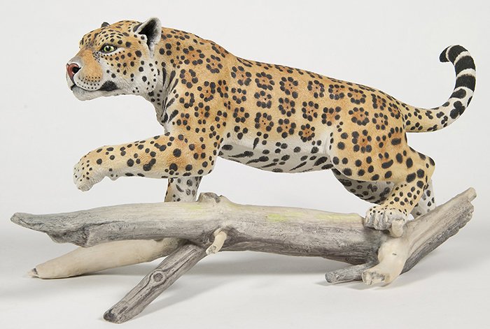 Boehm Porcelain Jaguar: Marked on side of log “Boehm” and on base of log “Boehm/Bone Porcelain/Jaguar/(Panthra onca)/500-20/Number 76 Year 1981/Made in England”, 17.5” long x 9.5” high.