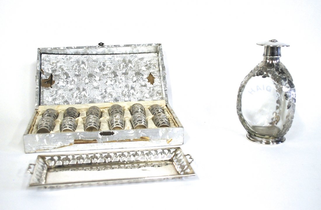 Soto Sterling Liquor Set: Outstanding Mexican Sterling Liquor Set. Tray, decanter with stopper, and twelve liquor glasses. Fine engraved floral pattern. Manufacturers mark to underside. Decanter 8.5 inches, tray 11.25 inches, 
