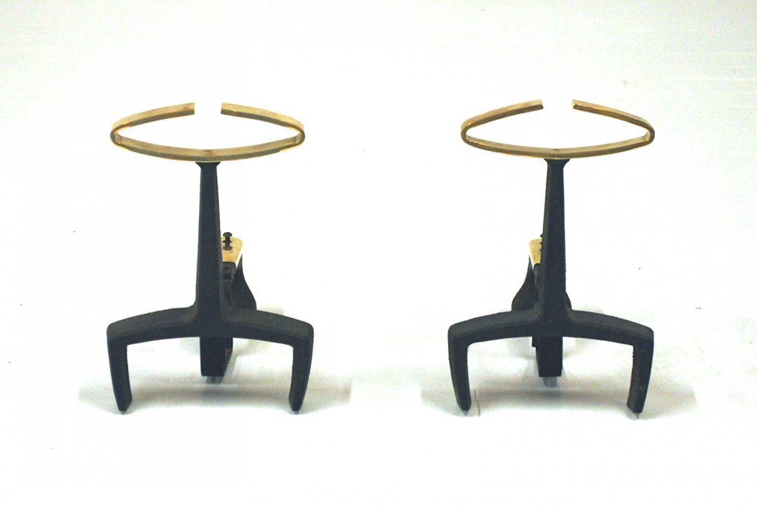 Donald Deskey: Iron and brass. Bennett. Original brass manufacturer mark to back. The cleanest pair I have ever seen. Size 9W x 18D x 13H.