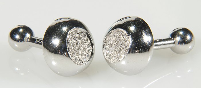 18KT White Gold & Diamond Tiffany Cuff Links: 18kt white gold & diamond Tiffany cuff links. Approx. 50 diamonds, that are approx. 0.50cts. Total weight, including stones, 12.8dwt including stones. Collection of Tom Powell.