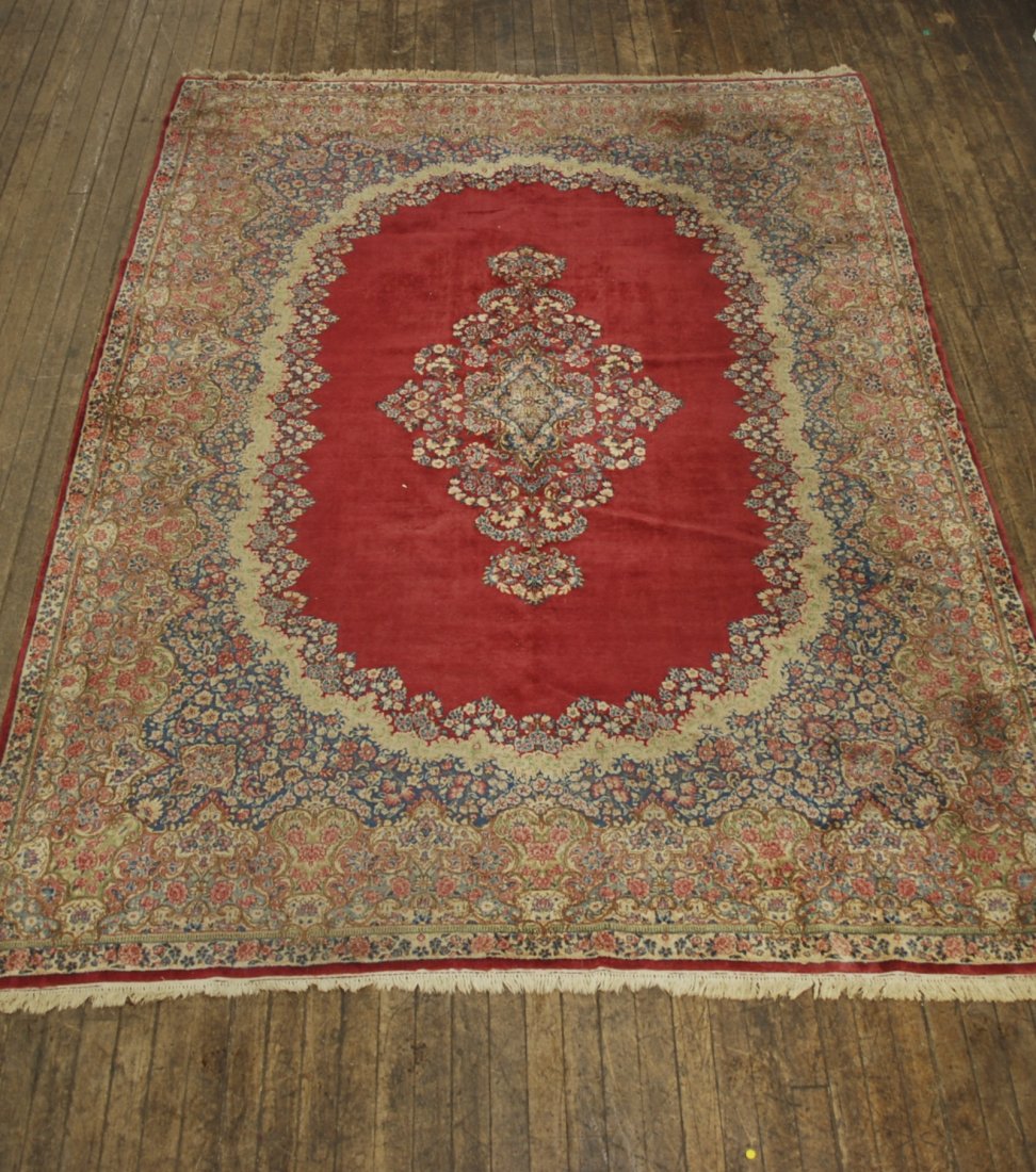 Kerman: Kerman floral field, oval center, rose, blue, green. 118 x 166. Collection of Tom Powell