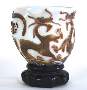 Chinese Kangxi Period Colass Cup: Brown overlay dragon, fish and frog decoration over white glass. Qing Dynasty. Size, 3.5 diameter x 3.25. Collection of Dr. Robert Kemper.