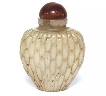 18th Century Bright White Jade Snuff Bottle: White Jade with red cap, Qing Dynasty. 2.25H. Collection of Dr. Robert Kemper.