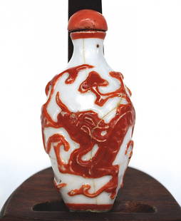 19th Century Snuff Bottle: White Porcelain with red cap, Qing Dynasty. Size, 3H. Collection of Dr. Robert Kemper.