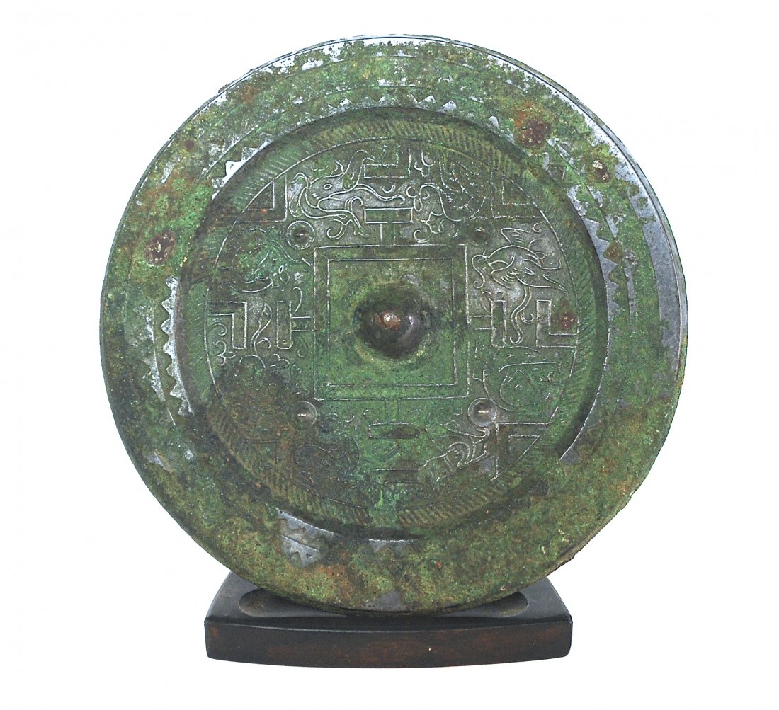 Third Century Chinese Bronze Mirror of TLV: Han Dynasty. Size, 4.75. Collection of Dr. Robert Kemper.