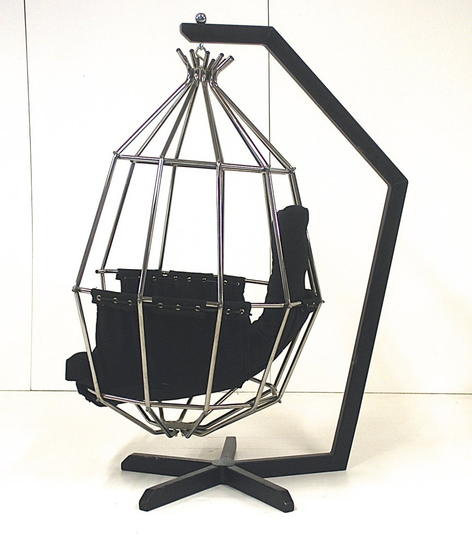 Parrot Chair/Ib Arberg Papagojan: Iconic hanging birdcage chair, Sweden, 1970. Enameled metal, chrome plated metal, upholstery, plastic. Size, 36 x 48 x 64.