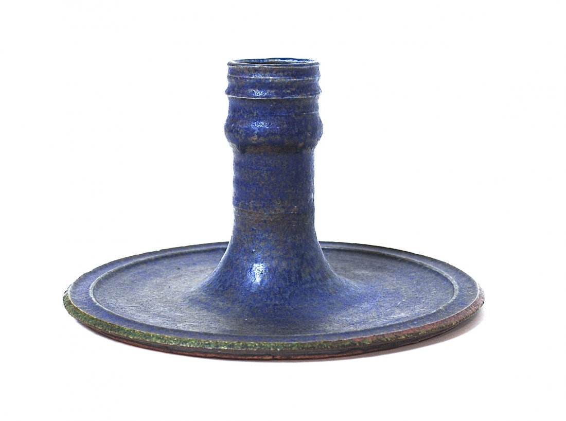 Arabia: Artist signed ceramic candlestick. Signature illegible. Manufacturers mark to underside. Made in Finland. Size, 9.75 diameter x 6H