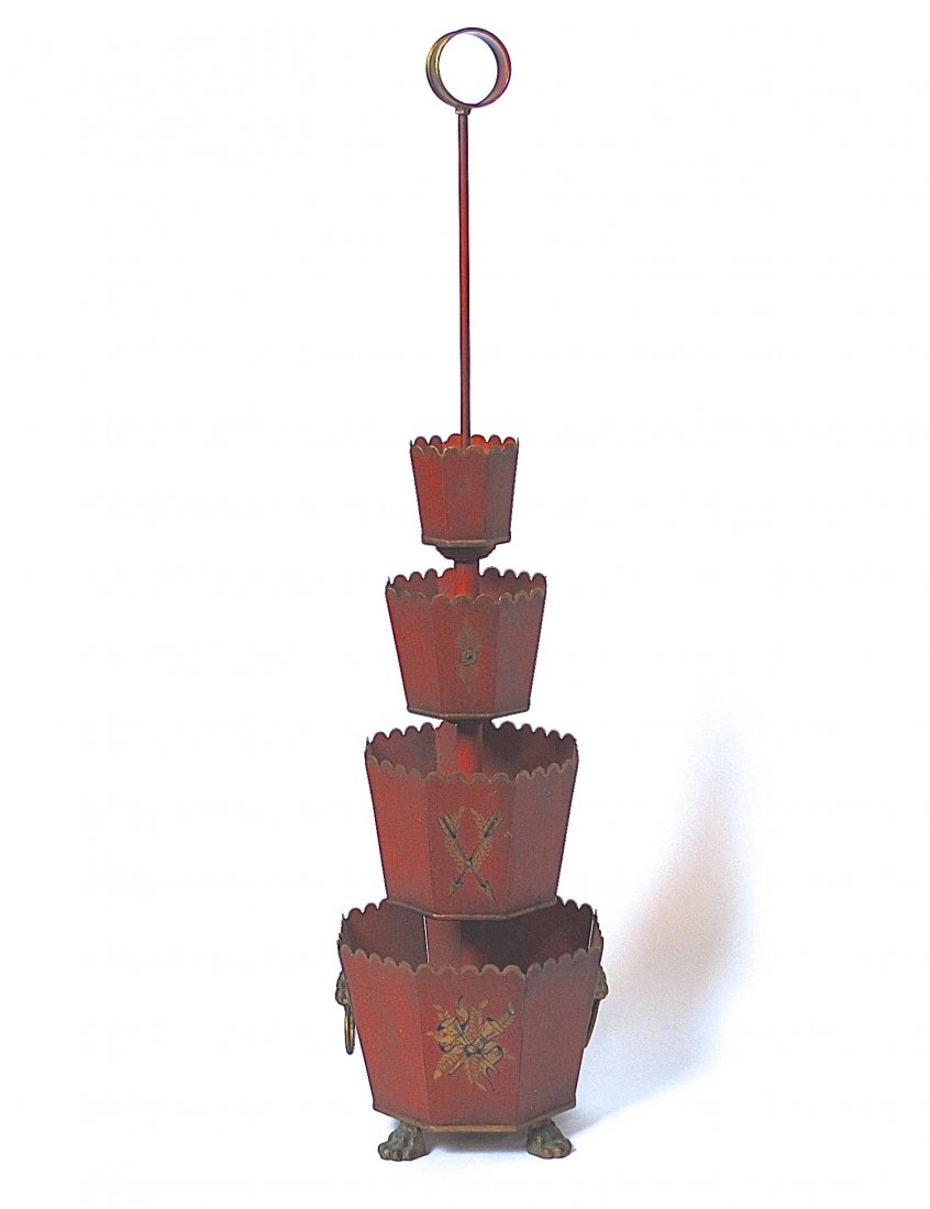 French Tole Flower Holder: Unusual four tier center piece with scalloped rims, lion rings and claw feet. Hand decorated with floral arrangements and gold accents. Size, 31H