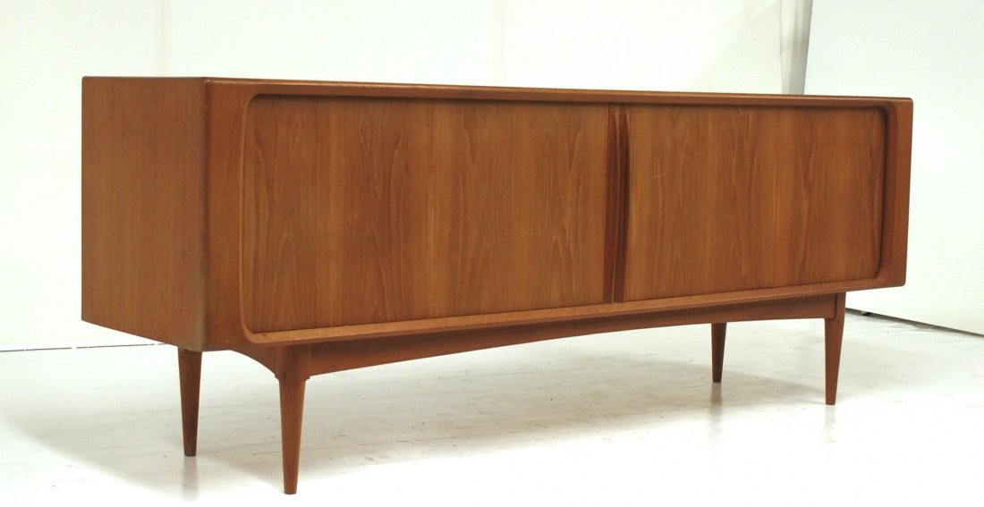 Arne Vodder: Credenza/sideboard. Tambour doors concealing ample storage and drawers. Teak. Size 83w X 19.75d X 31.5h.