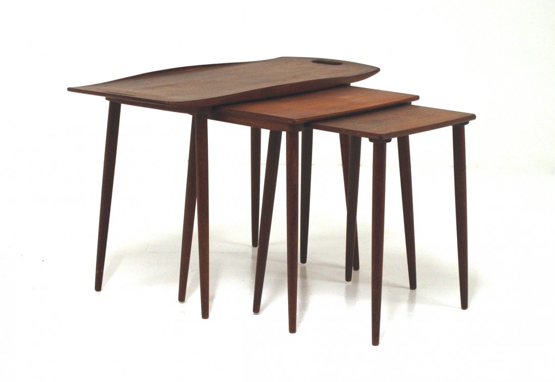 Danish Nesting Tables: Set of three graduated tables. Largest one with cut out handles. Size Large, 20.25H x 31.5L,