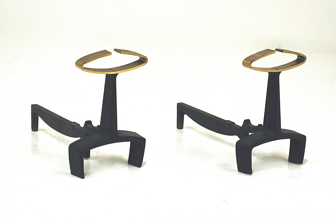 Donald Deskey: Andirons, Bennett, brass, Iron. Manufacturer's mark to log supports. Size 8 x 18 x 13H.