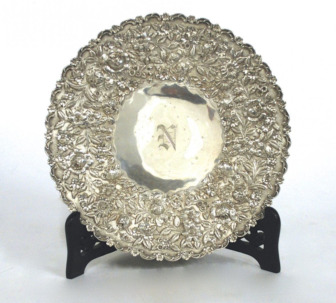 Sterling Repousse Compote: Ornate border with embossed daisies, roses, leaves and petals. Manufacturer unknown. Monogram "N" to center. 20ozt. Size 11diameter X 2h.